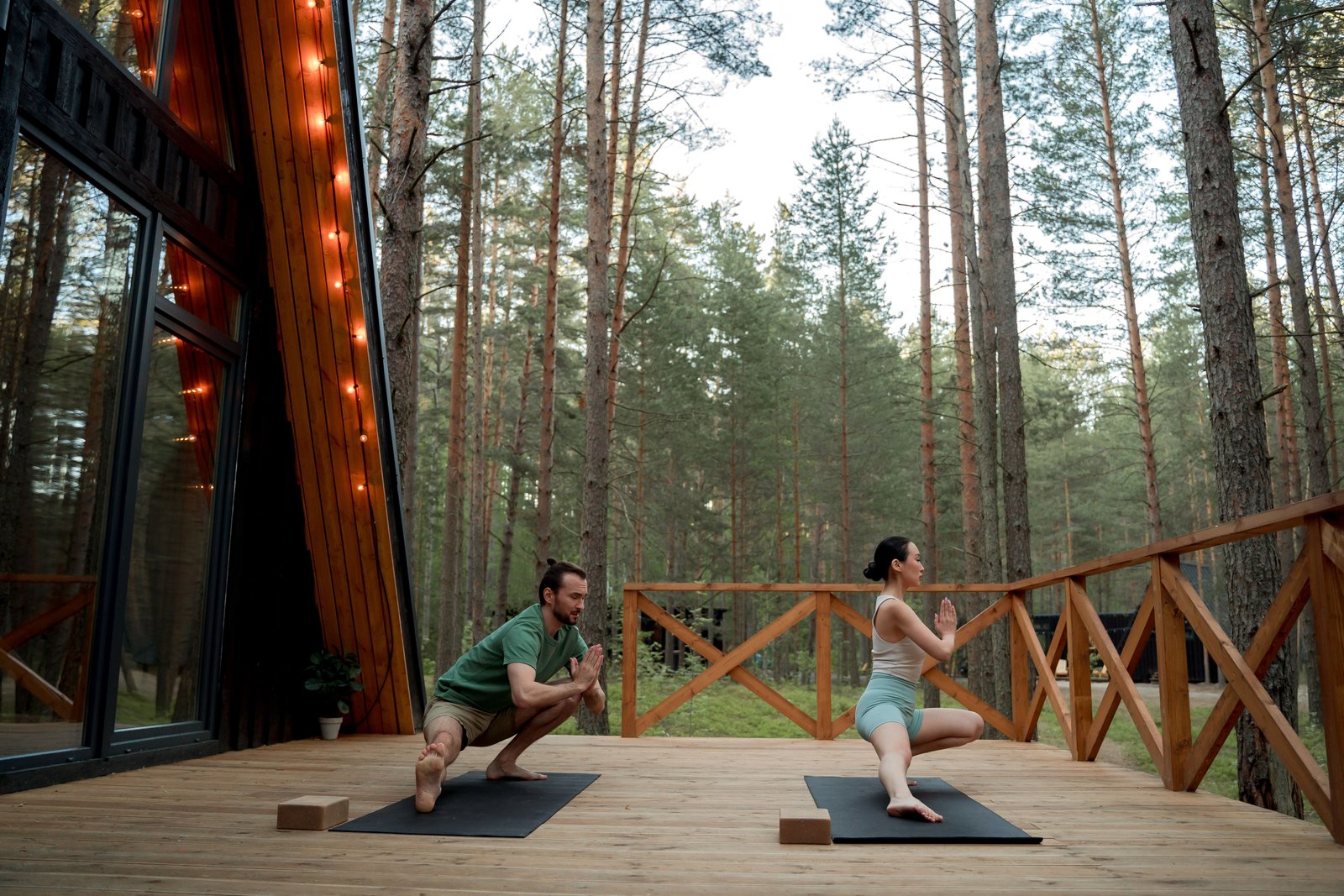 International students practicing in the open-air shala at Praba Yoga